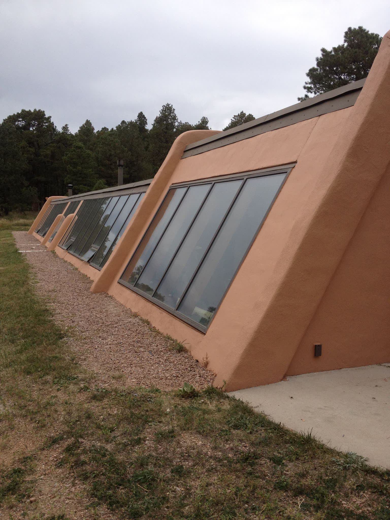 Angled stucco commercial elevation with glazing