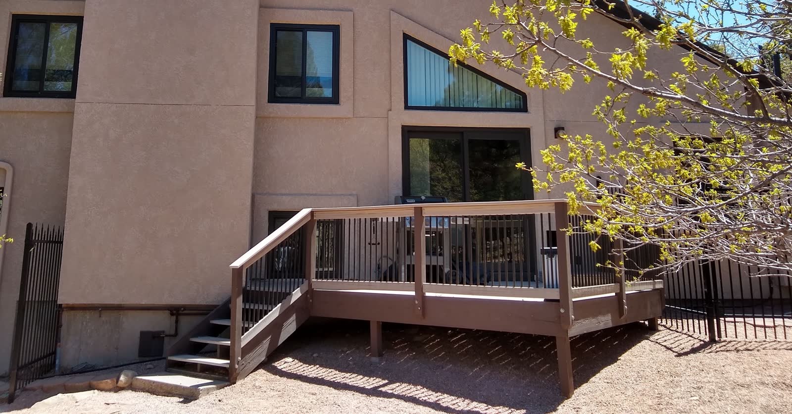 Restored Colorado deck with fresh stain after sanding and board replacement